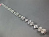 3.98CT DIAMOND 18KT WHITE GOLD INVISIBLE FLOWER OVAL BY THE YARD TENNIS BRACELET