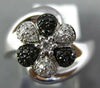 ESTATE .25CT WHITE & BLACK DIAMOND 14KT WHITE GOLD FLOWER CRISS CROSS FUN RING