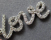 ESTATE .16CT DIAMOND 14KT WHITE GOLD 3D SCRIPT LOVE FLOATING PENDANT