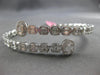 LARGE 5.69CT DIAMOND 18KT WHITE GOLD ROUND & BAGUETTE INVISIBLE BANGLE BRACELET