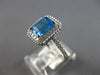 1.44CT DIAMOND & AAA BLUE TOPAZ 14KT WHITE GOLD 3D EMERALD CUT & ROUND HALO RING