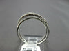 ESTATE .42CT DIAMOND 18KT WHITE GOLD 3D ROUND & BAGUETTE CRISS CROSS FUN RING