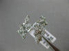 ESTATE WIDE 18KT WHITE GOLD LOVE RING. 3D MULTI LEAF CRISS CROSS DESIGN