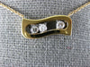 ESTATE .17CT DIAMOND 18KT WHITE & ROSE GOLD 3 STONE ETOILE FLOATING LOVE PENDANT