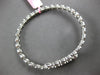LARGE 5.69CT DIAMOND 18KT WHITE GOLD ROUND & BAGUETTE INVISIBLE BANGLE BRACELET