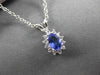 ESTATE .62CTW DIAMOND & AAA TANZANITE 14KT WHITE GOLD OVAL CLUSTER PENDANT
