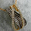 LARGE .75CT WHITE & PINK DIAMOND 18KT ROSE & BLACK GOLD CRISS CROSS WAVE PENDANT