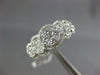 ESTATE 1.07CT DIAMOND 18KT WHITE GOLD MULTI FLOWER HALO CLASSIC ANNIVERSARY RING
