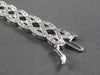 WIDE 4.20CT DIAMOND 14KT WHITE GOLD ROUND CRISS CROSS INFINITY TENNIS BRACELET