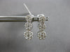 1.0CT DIAMOND 14KT WHITE GOLD 3D MULTI FLOWER JOURNEY SCREWBACK HANGING EARRINGS