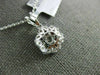 ESTATE .74CT DIAMOND & AAA RUBY 18KT WHITE GOLD CLASSIC FLOWER FLOATING PENDANT