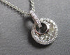 ESTATE .20CT DIAMOND 14KT WHITE GOLD ROUND & BAGUETTE CIRCULAR FLOATING PENDANT