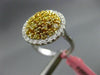 ESTATE LARGE 1.09CT DIAMOND 18KT WHITE & YELLOW GOLD HALO CIRCULAR COCKTAIL RING