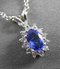 ESTATE .62CTW DIAMOND & AAA TANZANITE 14KT WHITE GOLD OVAL CLUSTER PENDANT