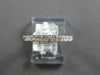 ESTATE .60CT DIAMOND 18KT WHITE GOLD PRINCESS CHANNEL INVISIBLE ANNIVERSARY RING