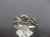 ESTATE .06CT DIAMOND 14KT WHITE AND YELLOW GOLD 3D CLASSIC INFINITY LOVE RING