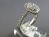 .82CT DIAMOND 18KT WHITE GOLD 3D CLASSIC ROUND CLUSTER HALO OVAL FRIENDSHIP RING