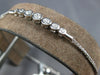 .34CT DIAMOND 18K WHITE GOLD 7 STONE BEZEL GRADUATING ADJUSTABLE TENNIS BRACELET