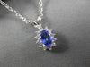 ESTATE .62CTW DIAMOND & AAA TANZANITE 14KT WHITE GOLD OVAL CLUSTER PENDANT