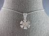 ESTATE .63CT DIAMOND 14KT WHITE GOLD 3D ROUND & BAGUETTE FLOWER FLOATING PENDANT