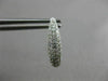 ESTATE .71CT DIAMOND 18KT WHITE GOLD CLASSIC ELONGATED PAVE OVAL HUGGIE EARRINGS