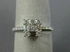 ESTATE .57CT ROUND & BAGUETTE DIAMOND 18KT WHITE GOLD CLUSTER SEMI ETERNITY RING