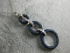 2.16CT DIAMOND & SAPPHIRE 18KT WHITE & BLACK GOLD CIRCULAR JOURNEY LOVE PENDANT