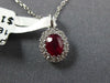 SMALL .62CT DIAMOND & AAA RUBY 18KT WHITE GOLD 3D ROUND & OVAL FLOWER PENDANT