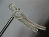 3.61CT DIAMOND 18KT WHITE GOLD 3D ROUND & BAGUETTE DOUBLE SWIRL HANGING EARRINGS