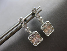 ESTATE .45CT DIAMOND 14KT WHITE GOLD ROUND & BAGUETTE INVISIBLE HANGING EARRINGS