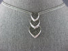 ESTATE .78CT WHITE & BLACK DIAMOND 14KT WHITE GOLD 3D HEART JOURNEY LOVE PENDANT