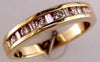 ESTATE .50CT DIAMOND 14KT YELLOW GOLD ROUND & BAGUETTE CHANNEL ANNIVERSARY RING