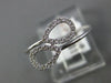 ESTATE .11CT DIAMOND 14KT WHITE GOLD 3D DOUBLE PEAR SHAPE LEAF CRISS CROSS RING