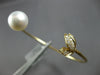 ESTATE .22CT DIAMOND & SOUTH SEA PEARL 14KT YELLOW GOLD FLEXIBLE BANGLE BRACELET