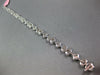 3.98CT DIAMOND 18KT WHITE GOLD INVISIBLE FLOWER OVAL BY THE YARD TENNIS BRACELET