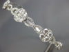 ESTATE WIDE 1.76CT DIAMOND 18KT WHITE GOLD 3D INFINITY FLOWER BANGLE BRACELET