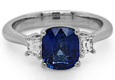 4.86CT DIAMOND & AAA SAPPHIRE 18KT WHITE GOLD CUSHION & EMERALD CUT 3 STONE RING