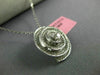 ESTATE .83CT DIAMONDS 18KT WHITE GOLD CIRCULAR MULTI ROW SWIRL SOLITAIRE PENDANT