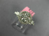 ESTATE .86CT DIAMOND 18KT WHITE GOLD 3D ROUND & PRINCESS FLOWER HALO LOVE RING