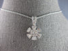 ESTATE .63CT DIAMOND 14KT WHITE GOLD 3D ROUND & BAGUETTE FLOWER FLOATING PENDANT