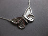 ESTATE LARGE .52CT WHITE & BLACK DIAMOND 14KT WHITE GOLD BUTTERFLY LOVE NECKLACE