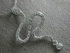 ESTATE .21CT ROUND DIAMOND 14K WHITE GOLD CLASSIC HAPPY SNAKE FLOATING PENDANT