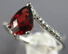 1.18CT DIAMOND & AAA GARNET 14KT WHITE GOLD PEAR SHAPE & ROUND CRISS CROSS RING