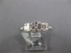 ESTATE .64CT DIAMOND 18KT WHITE GOLD ROUND & BAGUETTE INVISIBLE SQUARE LOVE RING