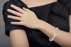 LARGE 4.72CT DIAMOND 18KT WHITE GOLD ROUND & BAGUETTE LOVE KNOT TENNIS BRACELET