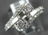 ESTATE .83CT DIAMOND 14KT WHITE GOLD 3D ROUND & BAGUETTE CRISS CROSS FUN RING