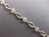 ESTATE 3.10CT DIAMOND 14KT WHITE GOLD MULTI FLOWER INFINITY LOVE TENNIS BRACELET