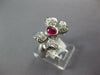 ESTATE .87CT DIAMOND & AAA RUBY PLATINUM 3D OVAL AND ROUND CLASSIC BOW RING