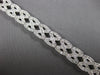WIDE 4.20CT DIAMOND 14KT WHITE GOLD ROUND CRISS CROSS INFINITY TENNIS BRACELET
