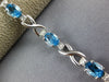 LONG 5.05CT DIAMOND & AAA BLUE TOPAZ 14KT WHITE GOLD OVAL X LOVE TENNIS BRACELET
